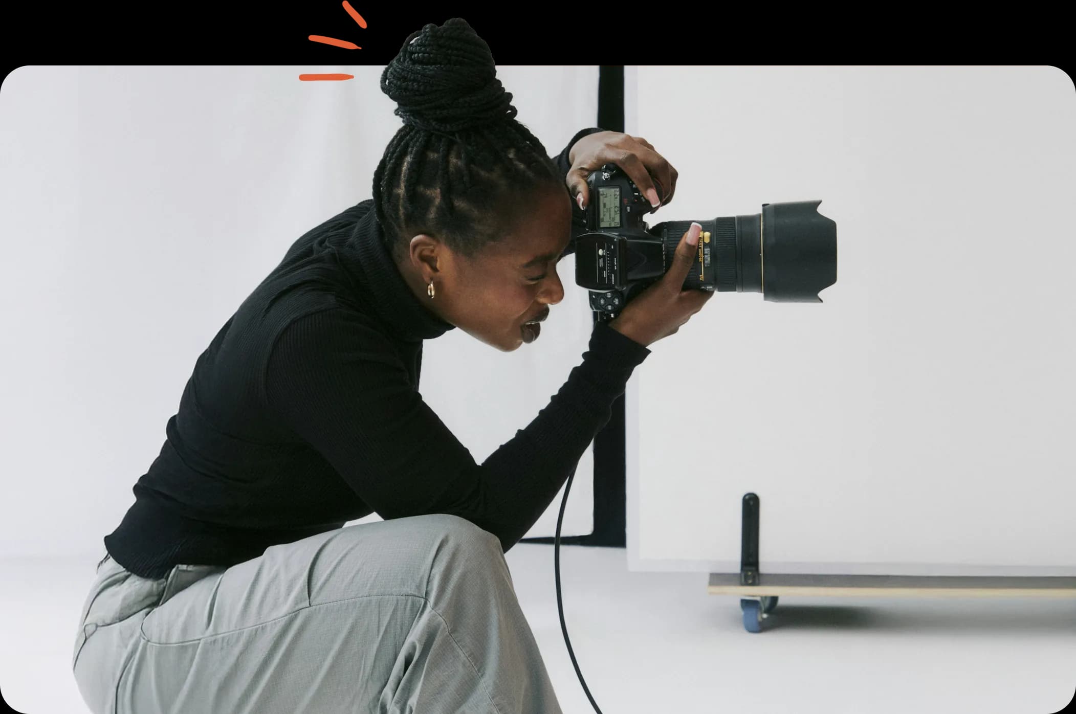Freelance photographer working in a studio.
